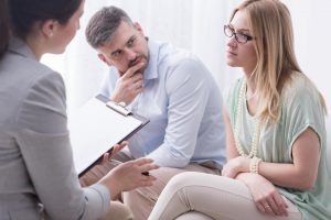 Counselor talking to a client.